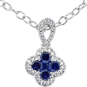 Blue Sapphire Cross Necklace There's nothing simple about this here necklace. Comprised of blue sapphires and augmented with 34 round diamonds, this cross necklace is one of our bestselling jewelry gifts.